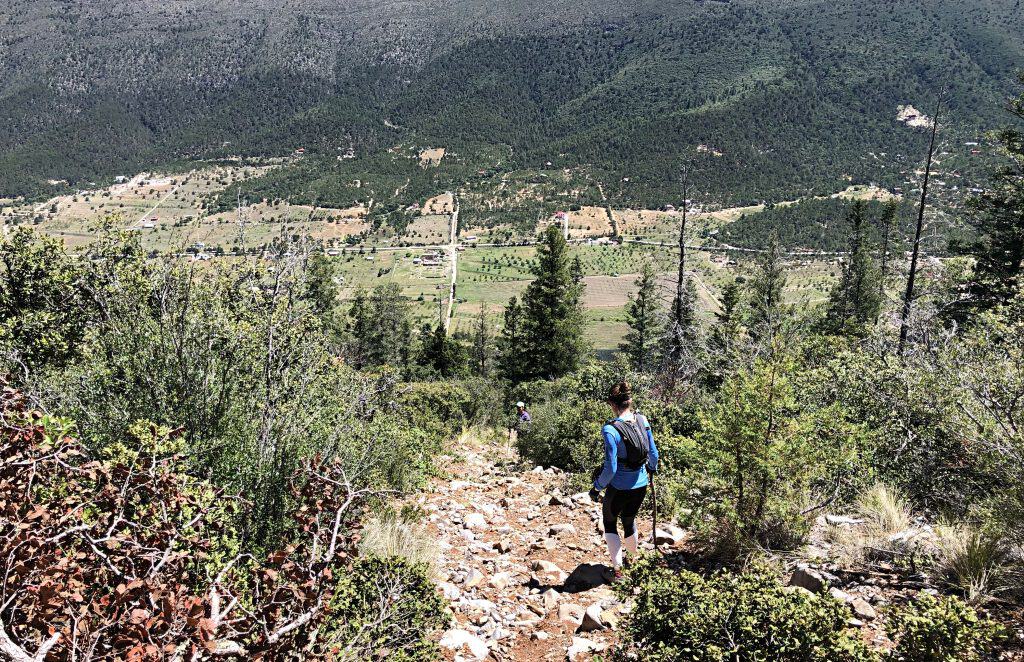 A hiker descending the rocky path down from La Viga in Arteaga