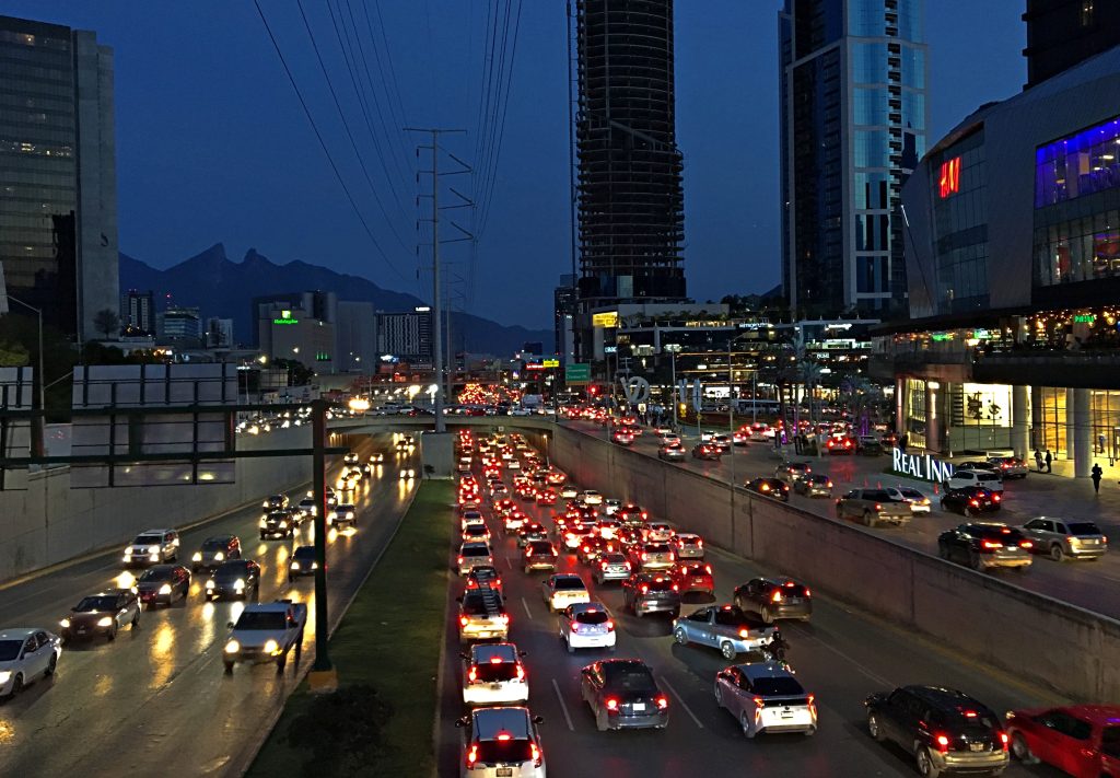 Monterrey traffic at night with Cerro de la Silla in the background.